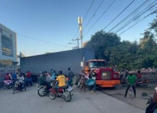 Haitianos presionan a ejecutivos de Codevi en busca de apoyo a Guy Philippe